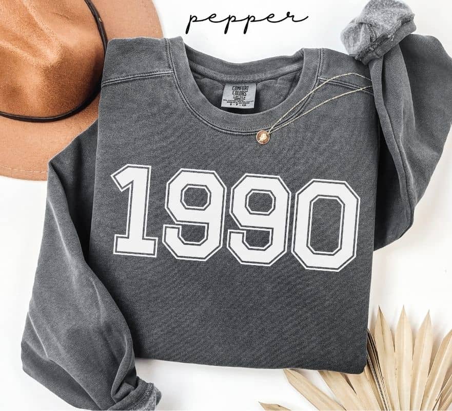 Gray (pepper) sweatshirt with '1990' print on a white background