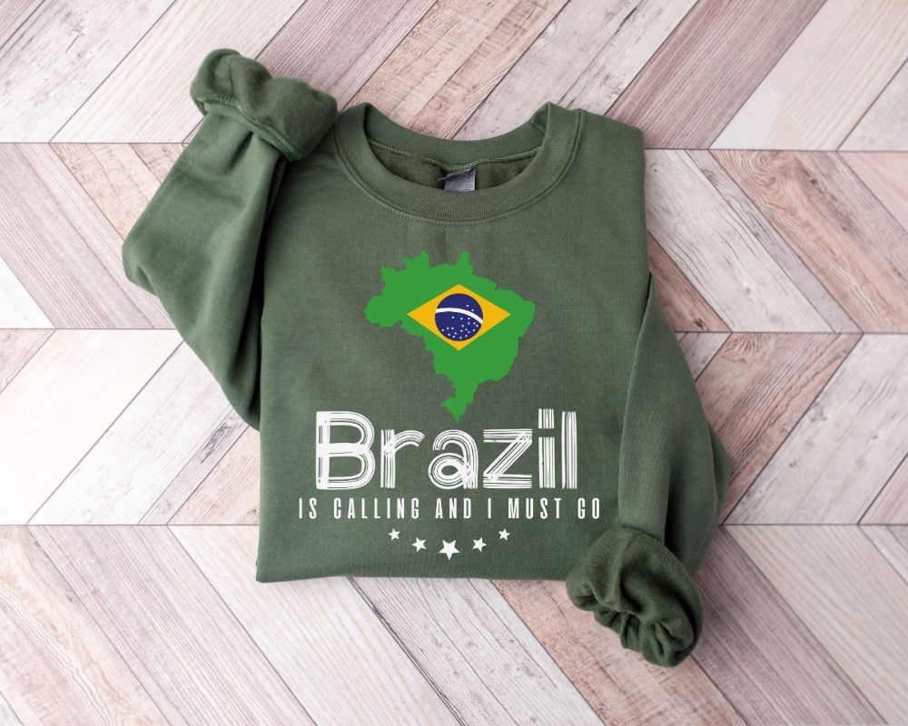 Military green sweatshirt with Brazil map and flag design on a wooden floor