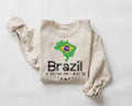 Beige (sand) sweatshirt with Brazil-themed design on a white background