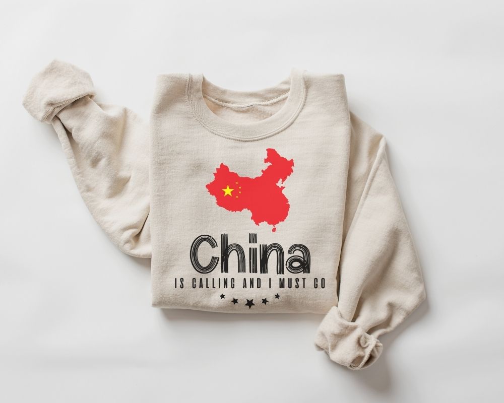 Beige (sand) sweatshirt featuring a red map of China with text displayed on a white background.