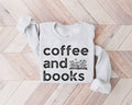 White (ash) sweatshirt with 'coffee and books' text on a wooden floor
