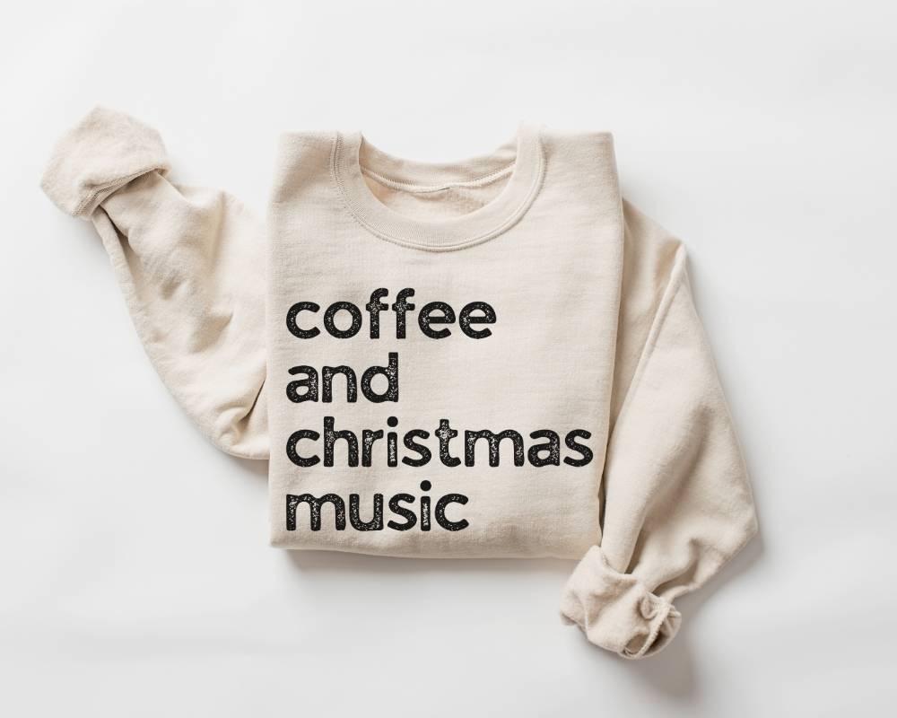 Beige (sand) sweatshirt with 'coffee and christmas music' text on a white background