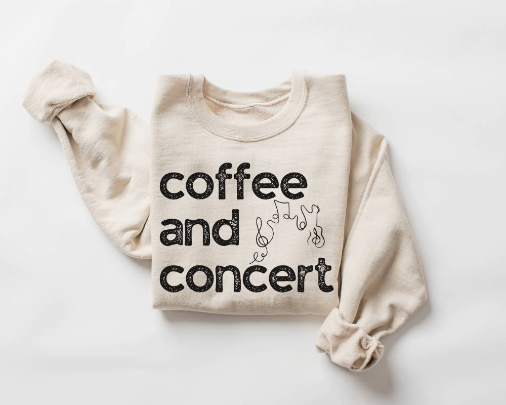 Beige (sand) sweatshirt with 'coffee and concert' text on a white background