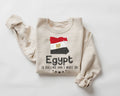 A beige (sand) sweatshirt featuring the Egyptian flag with text on a white background.