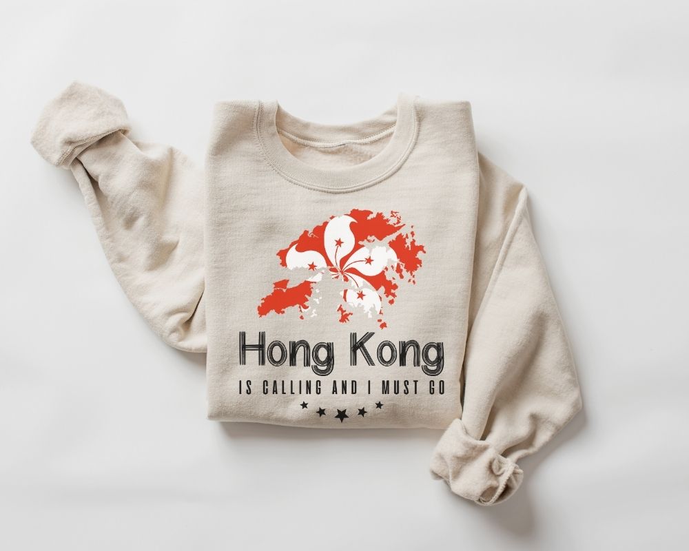 Beige (sand) sweatshirt with red and white design and text on a white background