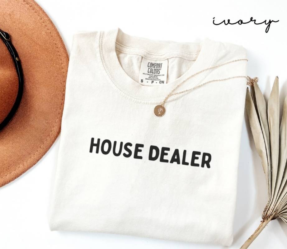 White (ivory) t-shirt with 'HOUSE DEALER' text, brown hat, and dried plant on a white background