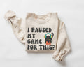 Beige (sand) sweatshirt with text and graphic on a white background