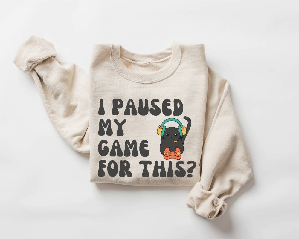 Beige (sand) sweatshirt with text and graphic on a white background
