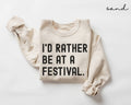 Beige (sand) sweatshirt with 'I'd Rather Be at a Festival' text on a white background