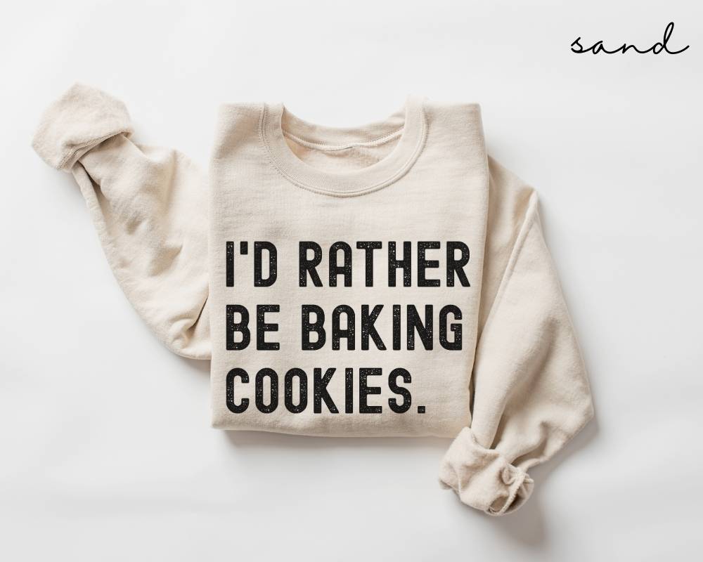 Beige (sand) sweatshirt with 'I'd rather be baking cookies' text on a white background