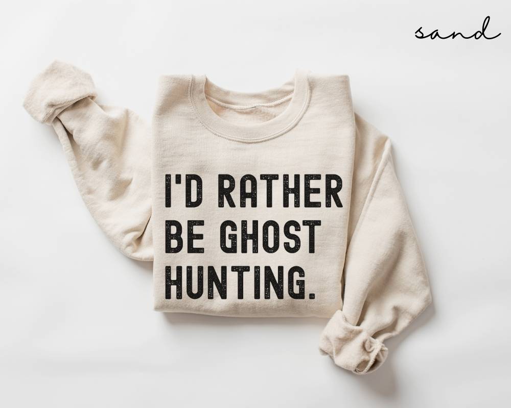 Beige (sand) sweatshirt with 'I'd Rather Be Ghost Hunting' text on a white background