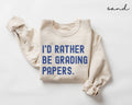 Beige (sand) sweatshirt with blue text 'I'd rather be grading papers' on a white background