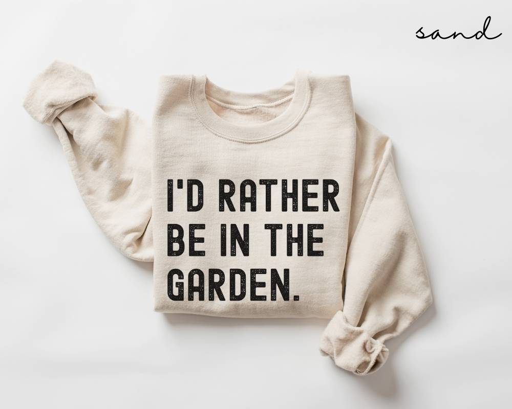 Beige (sand) sweatshirt with 'I'd Rather Be In The Garden' text on a white background