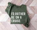 Military green sweatshirt with 'I'd Rather Be On A Cruise' text on a wooden floor.