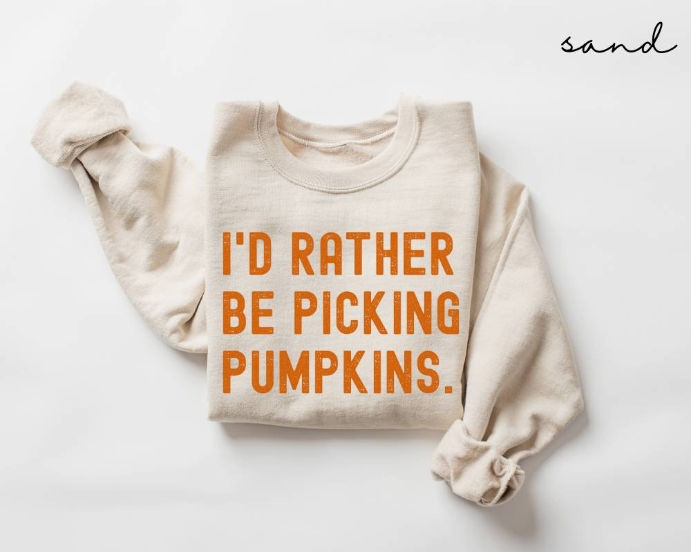 Beige (sand) sweatshirt with 'I'd Rather Be Picking Pumpkins' text on a white background