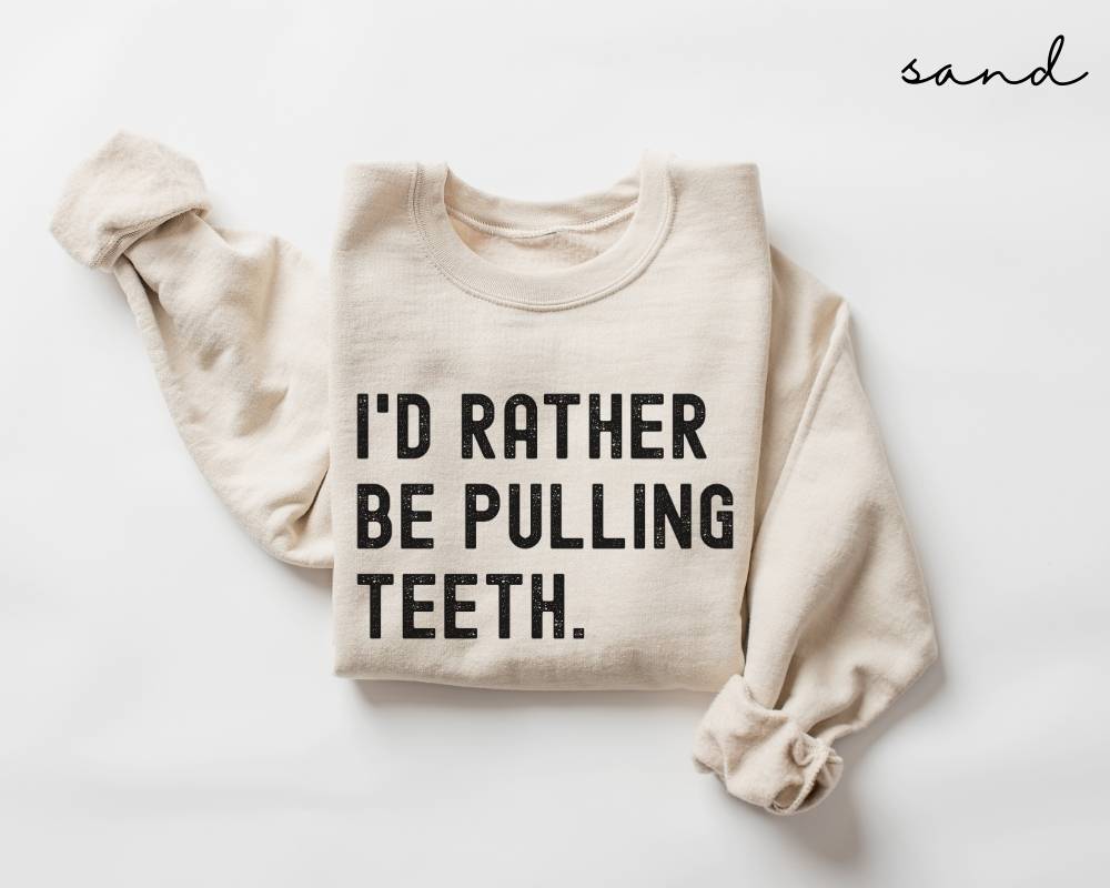 Beige (sand) sweatshirt with text 'I'd rather be pulling teeth' on a white background