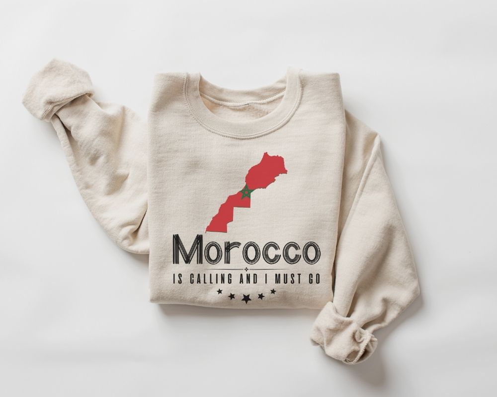 Beige (sand) sweatshirt with a graphic of a rose and text on a white background