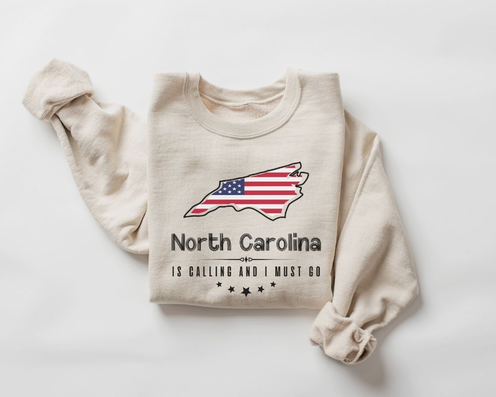 Beige (sand) sweatshirt with North Carolina design and text on a white background
