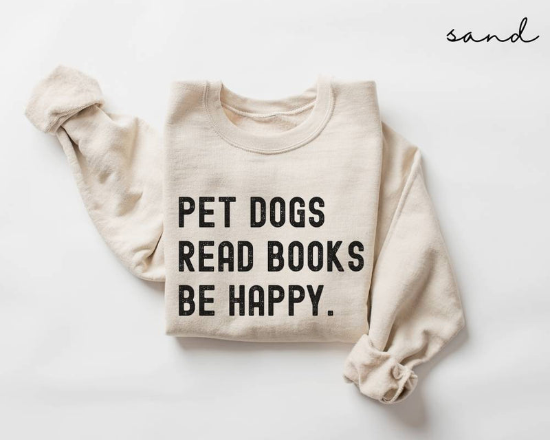 Beige (sand) sweatshirt with text 'PET DOGS READ BOOKS BE HAPPY' on a white background