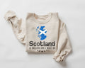 Beige (sand) sweatshirt with Scottish flag and text on a white background