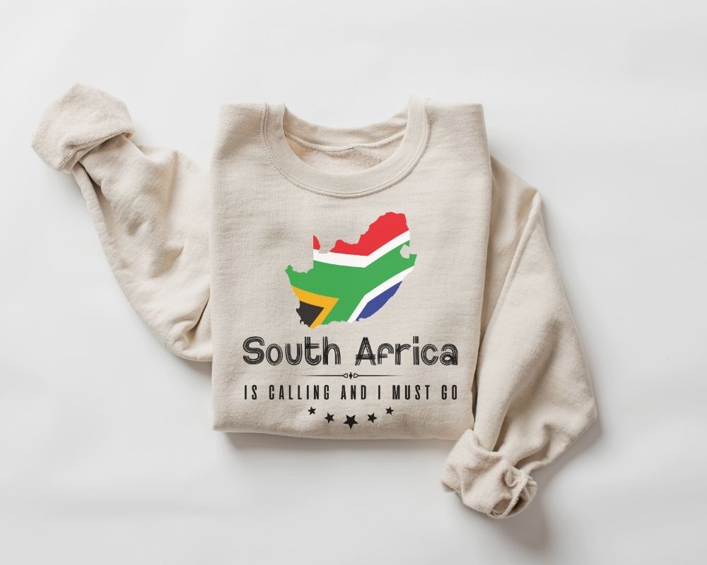 Beige (sand) sweatshirt with South African flag design and text on a white background.