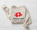 Beige (sand) sweatshirt with Swiss flag and text on a white background