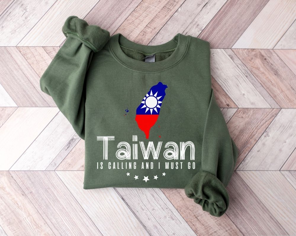 Military green sweatshirt with Taiwan flag design on a wooden floor
