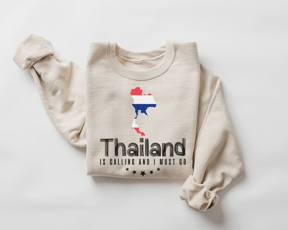 Beige (sand) sweatshirt with Thailand-themed design on a white background