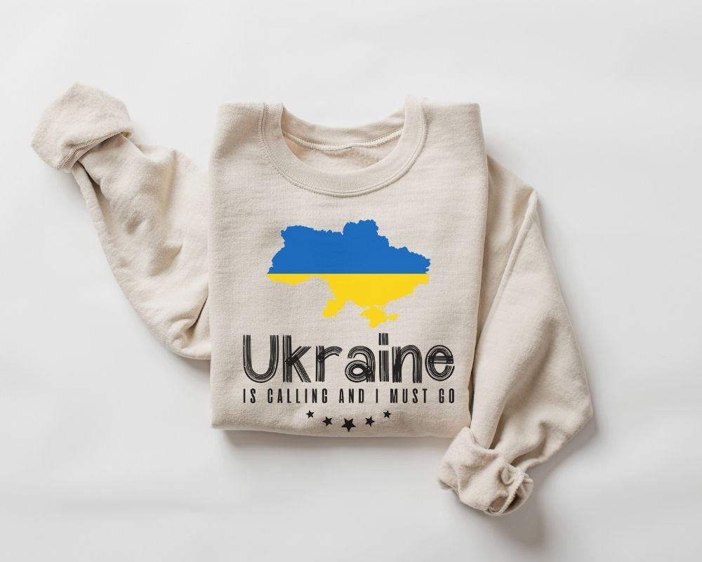 Beige (sand) sweatshirt with a blue and yellow map of Ukraine and text on a white background