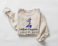 A beige (sand) sweatshirt featuring a British flag design and text on a white background.