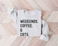 Gray (ash) sweatshirt with 'Weekends. Coffee. & Cats.' text on a wooden floor